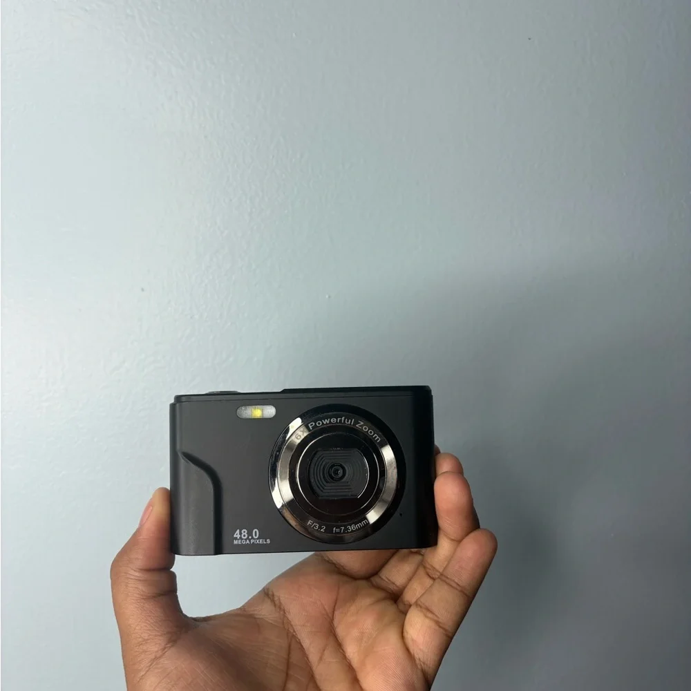Compact Black Camera with Silver Accents